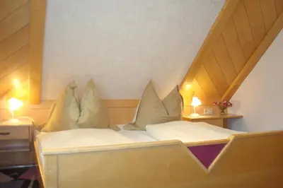 Ein Bett oder Betten in einem Zimmer der Unterkunft Gästehaus Moser