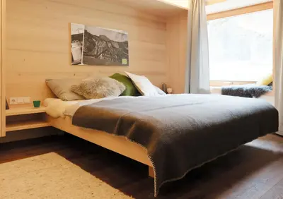 Ein Bett oder Betten in einem Zimmer der Unterkunft Alpenrose Boutique Chalet Gretl