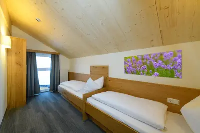 Ein Bett oder Betten in einem Zimmer der Unterkunft Wander- und Familienhotel Erika