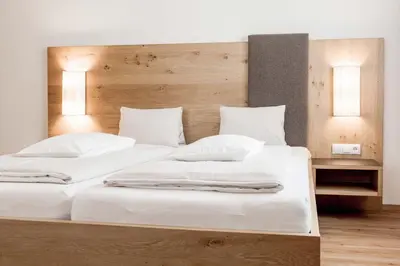 Ein Bett oder Betten in einem Zimmer der Unterkunft Die Barbara Appartements & Zimmer