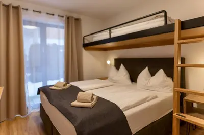 Ein Bett oder Betten in einem Zimmer der Unterkunft Appartements by Chalet Reiteralm -SKI IN SKI OUT