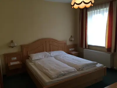 Ein Bett oder Betten in einem Zimmer der Unterkunft Gasthof Knappenwirt