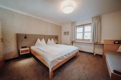 Ein Bett oder Betten in einem Zimmer der Unterkunft Landhaus Filzmoos