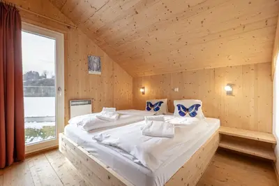 Ein Bett oder Betten in einem Zimmer der Unterkunft Feriendorf Murau by ALPS RESORTS