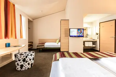 Ein Bett oder Betten in einem Zimmer der Unterkunft TUI BLUE Schladming