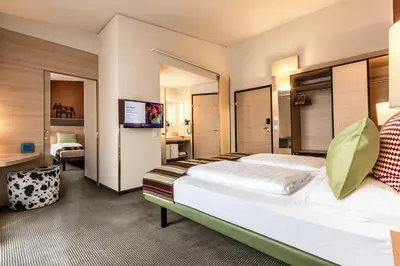 Ein Bett oder Betten in einem Zimmer der Unterkunft TUI BLUE Schladming