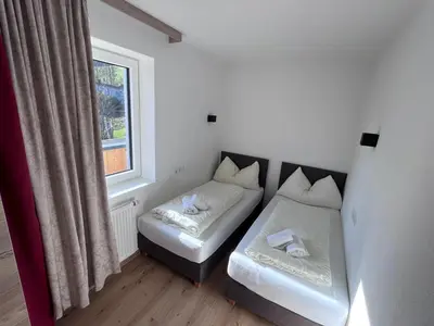 Ein Bett oder Betten in einem Zimmer der Unterkunft Apartments Monika - Altenmarkt