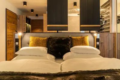 Ein Bett oder Betten in einem Zimmer der Unterkunft Sporthotel Snowwhite