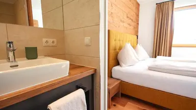 Ein Bett oder Betten in einem Zimmer der Unterkunft Sun Side by Schladming-Appartements