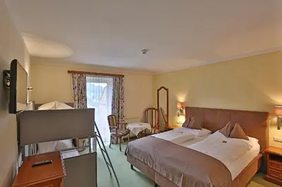 Ein Bett oder Betten in einem Zimmer der Unterkunft Ferienhotel Gewürzmühle