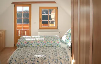 Ein Bett oder Betten in einem Zimmer der Unterkunft Ferienwohnung Mit Infarotkabi