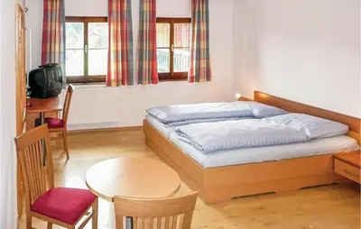 Ein Bett oder Betten in einem Zimmer der Unterkunft Ferienwohnung Mit Badeteich