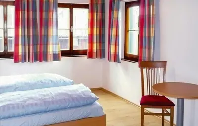 Ein Bett oder Betten in einem Zimmer der Unterkunft Ferienwohnung Mit Badeteich