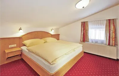 Ein Bett oder Betten in einem Zimmer der Unterkunft Ferienwohnung In Flachau