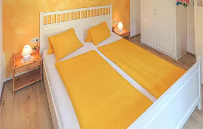 Ein Bett oder Betten in einem Zimmer der Unterkunft Nette Ferienwohnung Kleinarl