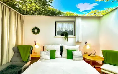 Ein Bett oder Betten in einem Zimmer der Unterkunft Große Ferienwohnungkleinarl