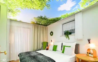 Ein Bett oder Betten in einem Zimmer der Unterkunft Große Ferienwohnungkleinarl