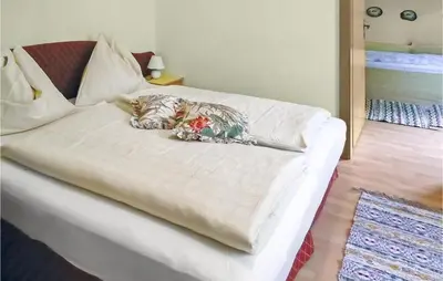 Ein Bett oder Betten in einem Zimmer der Unterkunft Ferienhaus In Ruhiger Lage