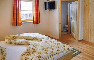 Ein Bett oder Betten in einem Zimmer der Unterkunft Ferienhaus Mit Sauna