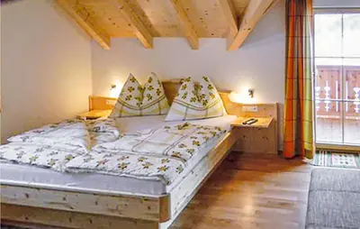 Ein Bett oder Betten in einem Zimmer der Unterkunft Ferienhaus Mit Sauna