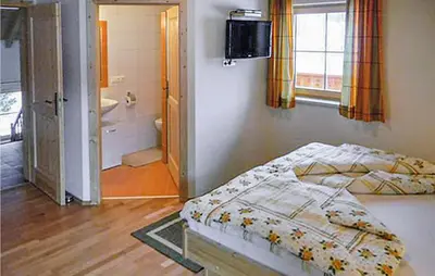 Ein Bett oder Betten in einem Zimmer der Unterkunft Ferienhaus Mit Sauna