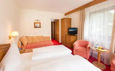 Ein Bett oder Betten in einem Zimmer der Unterkunft Hotel Dachstein