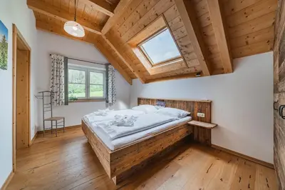 Ein Bett oder Betten in einem Zimmer der Unterkunft Oberweiglhof Penthouse
