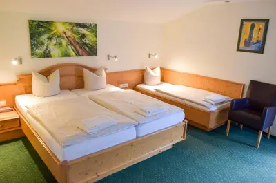 Ein Bett oder Betten in einem Zimmer der Unterkunft Salzburger Dolomitenhof