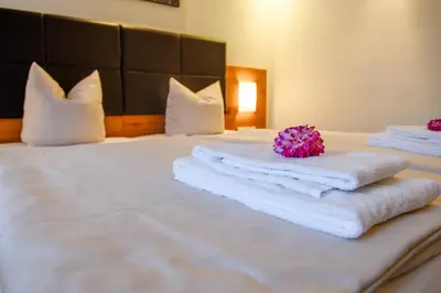 Ein Bett oder Betten in einem Zimmer der Unterkunft Salzburger Dolomitenhof