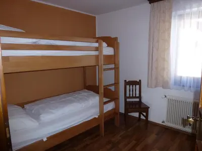 Ein Bett oder Betten in einem Zimmer der Unterkunft Ferienhaus Teigi