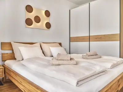 Ein Bett oder Betten in einem Zimmer der Unterkunft Panorama Lodge Alpine Living 201
