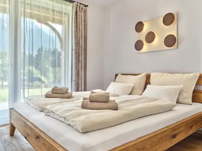 Ein Bett oder Betten in einem Zimmer der Unterkunft Panorama Lodge Alpine Living 201