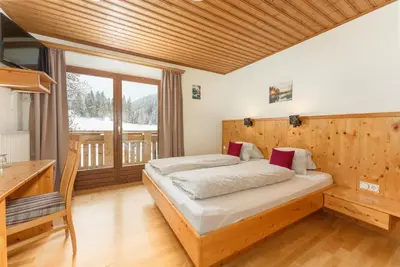 Ein Bett oder Betten in einem Zimmer der Unterkunft Winklhütte