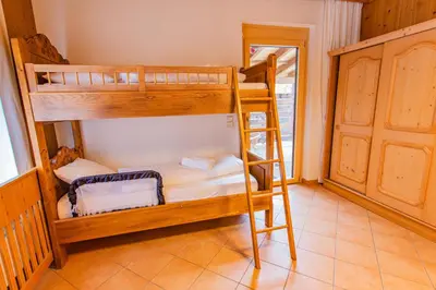 Ein Bett oder Betten in einem Zimmer der Unterkunft Bergidyll 5 by Alpenidyll Apartments