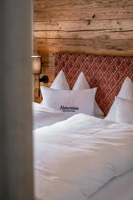 Ein Bett oder Betten in einem Zimmer der Unterkunft Natursinn Mountainchalets