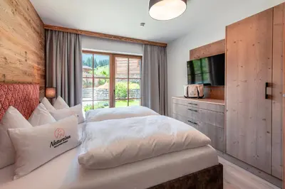 Ein Bett oder Betten in einem Zimmer der Unterkunft Natursinn Mountainchalets