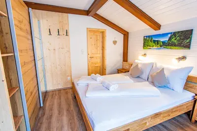 Ein Bett oder Betten in einem Zimmer der Unterkunft Bergidyll 10 by Alpenidyll Apartments