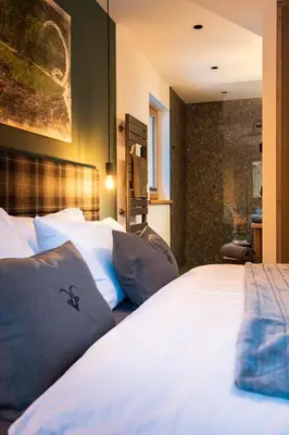 Ein Bett oder Betten in einem Zimmer der Unterkunft Lerchpeuntgut Alpenfreud Apartments
