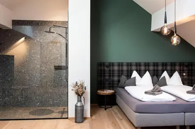 Ein Bett oder Betten in einem Zimmer der Unterkunft Lerchpeuntgut Alpenfreud Apartments