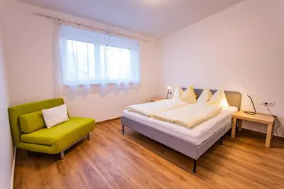 Ein Bett oder Betten in einem Zimmer der Unterkunft City Dream 1 by Alpenidyll Apartments