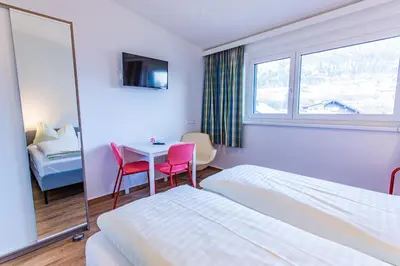 Ein Bett oder Betten in einem Zimmer der Unterkunft City Dream 2 by Alpenidyll Apartments