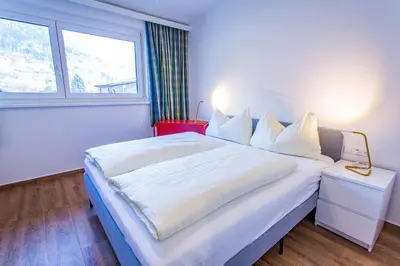 Ein Bett oder Betten in einem Zimmer der Unterkunft City Dream 2 by Alpenidyll Apartments