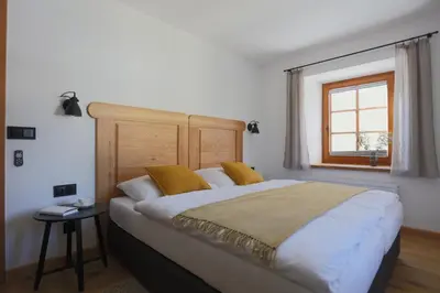 Ein Bett oder Betten in einem Zimmer der Unterkunft Schneiderhaus