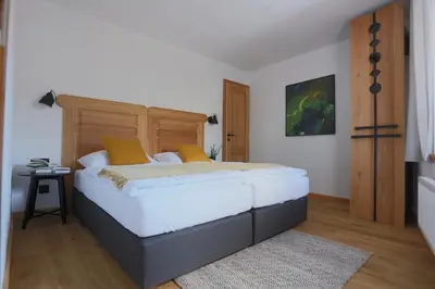 Ein Bett oder Betten in einem Zimmer der Unterkunft Schneiderhaus