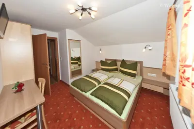 Ein Bett oder Betten in einem Zimmer der Unterkunft Appartement Haus Burgblick