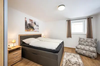 Ein Bett oder Betten in einem Zimmer der Unterkunft Ferienwohnung Weiß