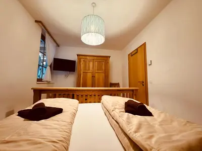 Ein Bett oder Betten in einem Zimmer der Unterkunft PREMIUM SKI IN/OUT - STEINADLER