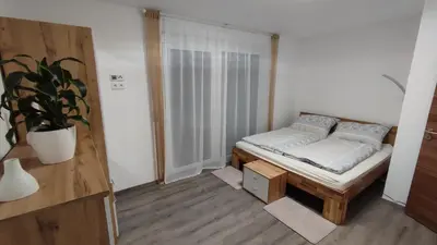 Ein Bett oder Betten in einem Zimmer der Unterkunft Panorama Apartmenthaus