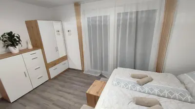 Ein Bett oder Betten in einem Zimmer der Unterkunft Panorama Apartmenthaus