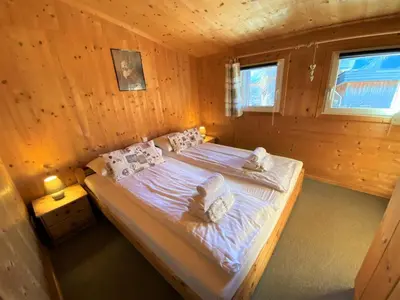 Ein Bett oder Betten in einem Zimmer der Unterkunft EXCLUSIVES Chalet an der SKIPISTE +Dampfbad +NETFLIX
